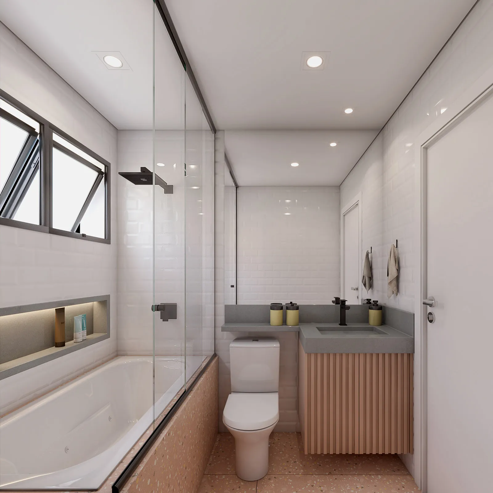 Banheiro com banheira e ducha preta, azulejo branco tipo metrô, bancada cinza com marcenaria ripada, torneira preta e piso de granilite rosé