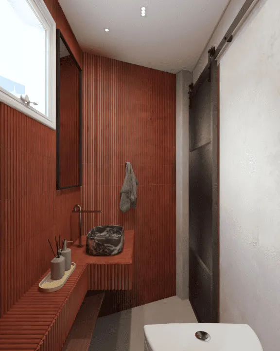 Render do lavabo com bancada ripada terracota, cuba de mármore preto, torneira dourada e porta de correr preta